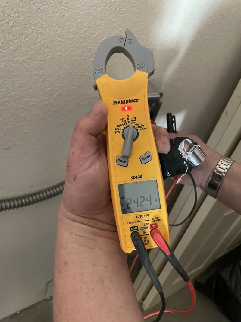 Voltage testing with clamp meter during Outlet Installation in Lodi